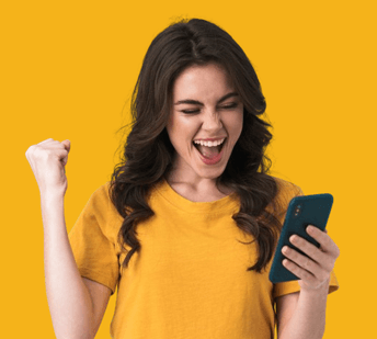 Excited young woman celebrating while looking at her smartphone.